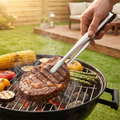 Stainless Steel Grill Tongs in use on a barbecue