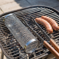 BBQ Grill Basket shown at true size on a barbecue grill next to sausages