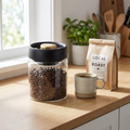 Coffee Beans Vacuum Sealed Tank shown at true size on a kitchen counter next to a mug